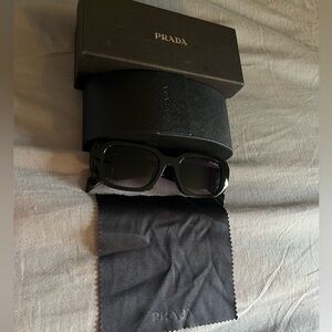 Black prada sunglasses with purple tint and case